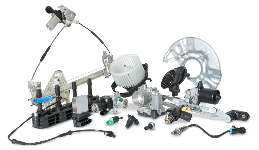 An assortment of automotive parts including a window regulator, blower motor, throttle body, sensors, wiring harnesses, and other mechanical and electronic vehicle components.