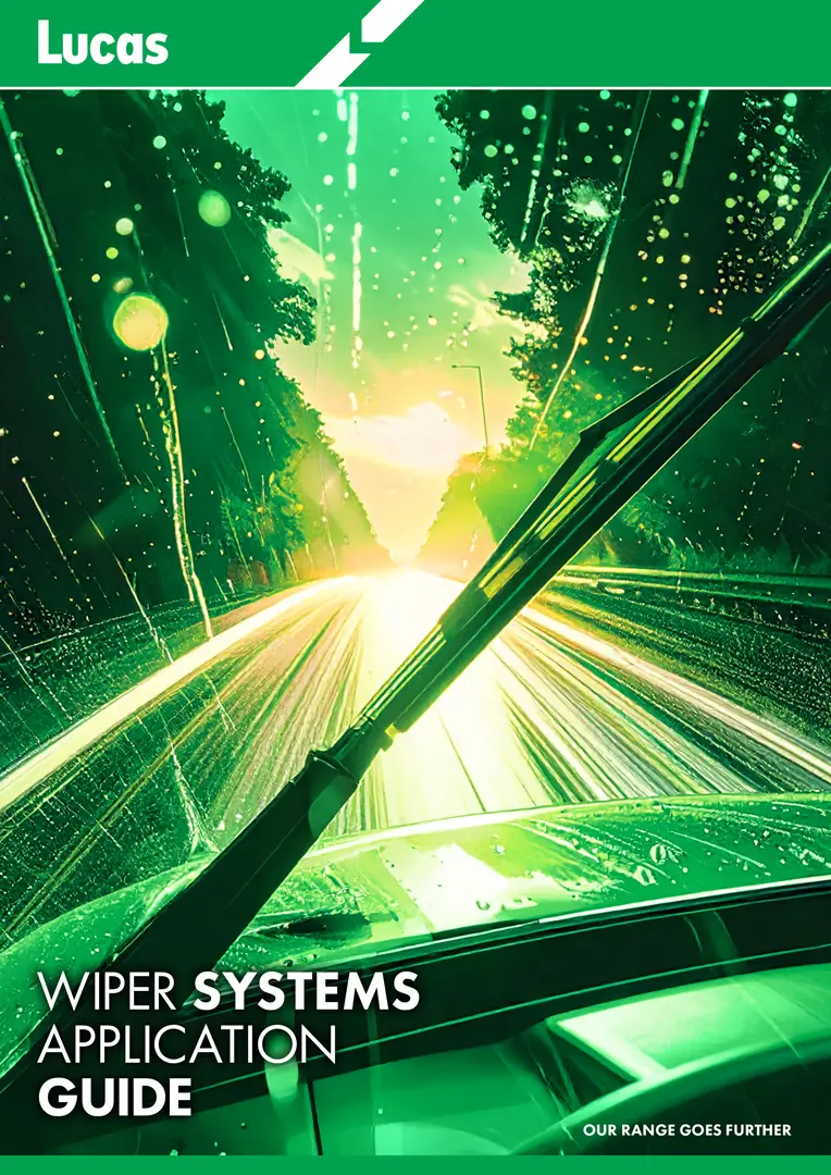 Cover of the Lucas Wiper Systems Application Guide showing a windscreen and wiper blade in motion during heavy rain, with bright light trails on a road framed by trees, and the Lucas logo in green at the top.