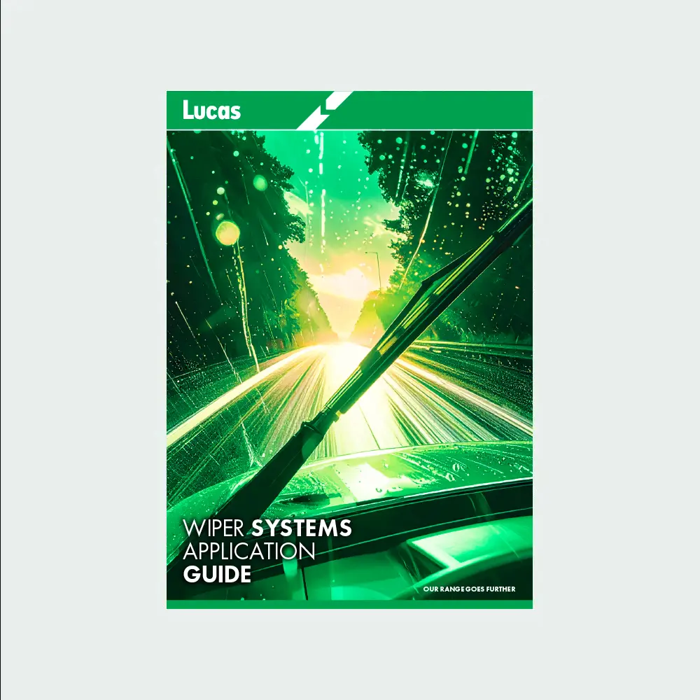 Cover of the Lucas Wiper Systems Application Guide showing a windscreen and wiper blade in motion during heavy rain, with bright light trails on a road framed by trees, and the Lucas logo in green at the top.